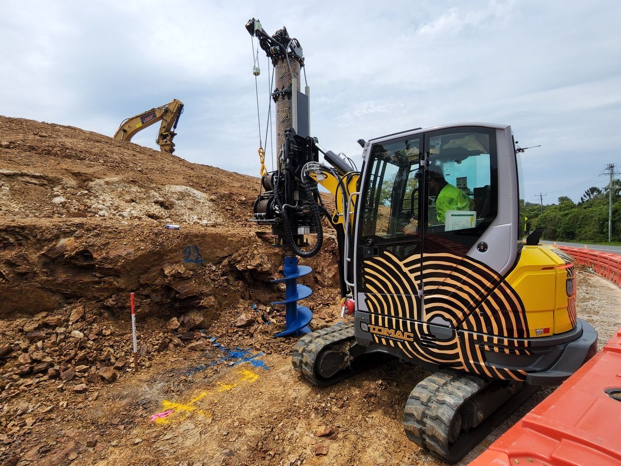 A Group of Construction Workers Are Standing on Top of a Building Under Construction — Tomac Civil In Burleigh Heads, QLD