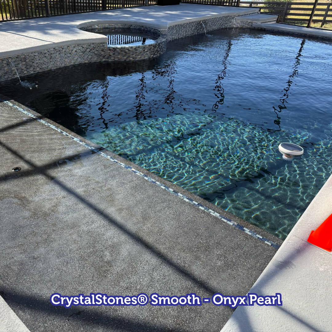 Pool with dark blue water and stone steps.