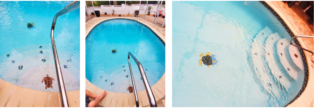 A person is cleaning a swimming pool with a vacuum cleaner.