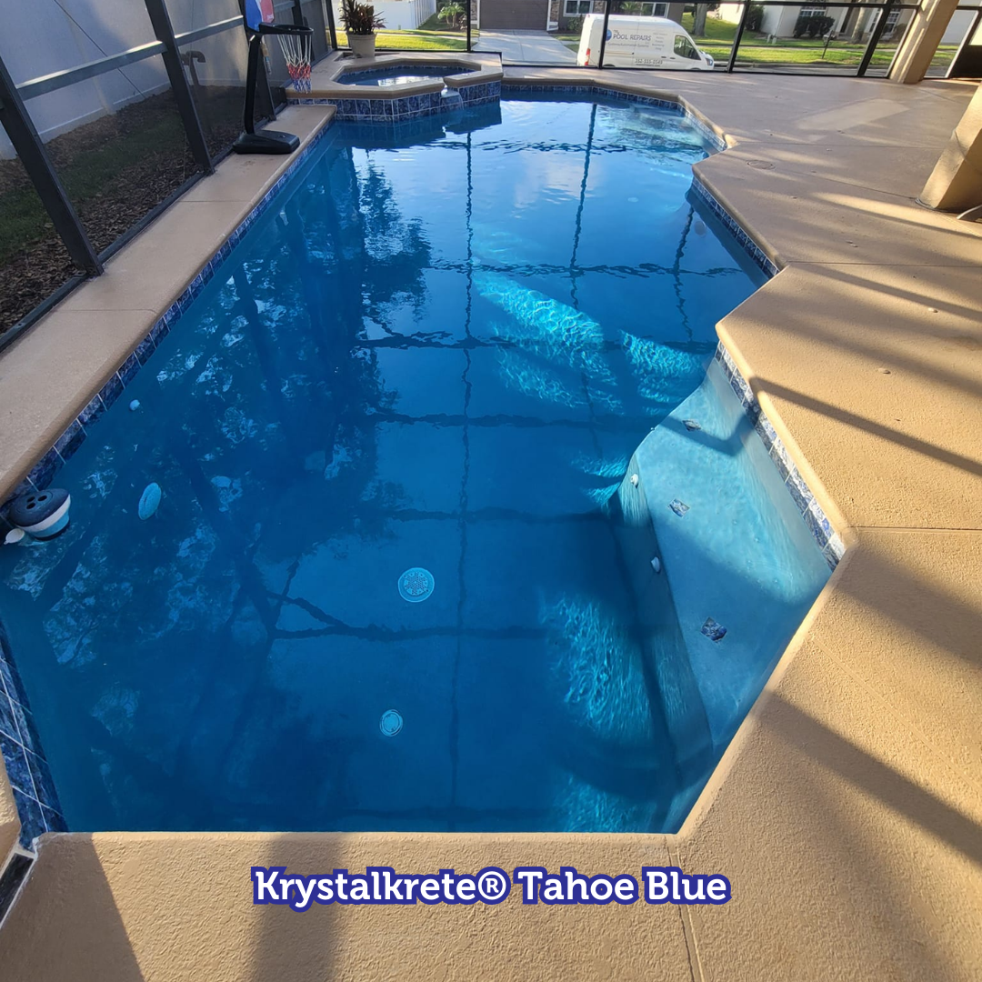 Pool with blue water and steps, surrounded by light brown concrete. Labeled 