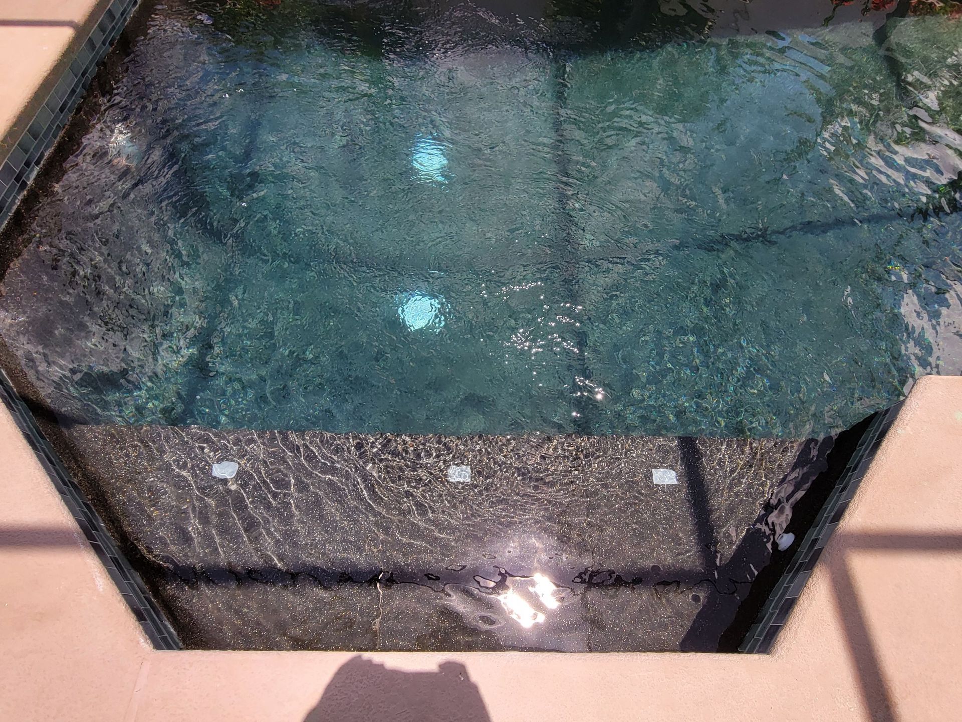 A pool of water with bubbles coming out of it