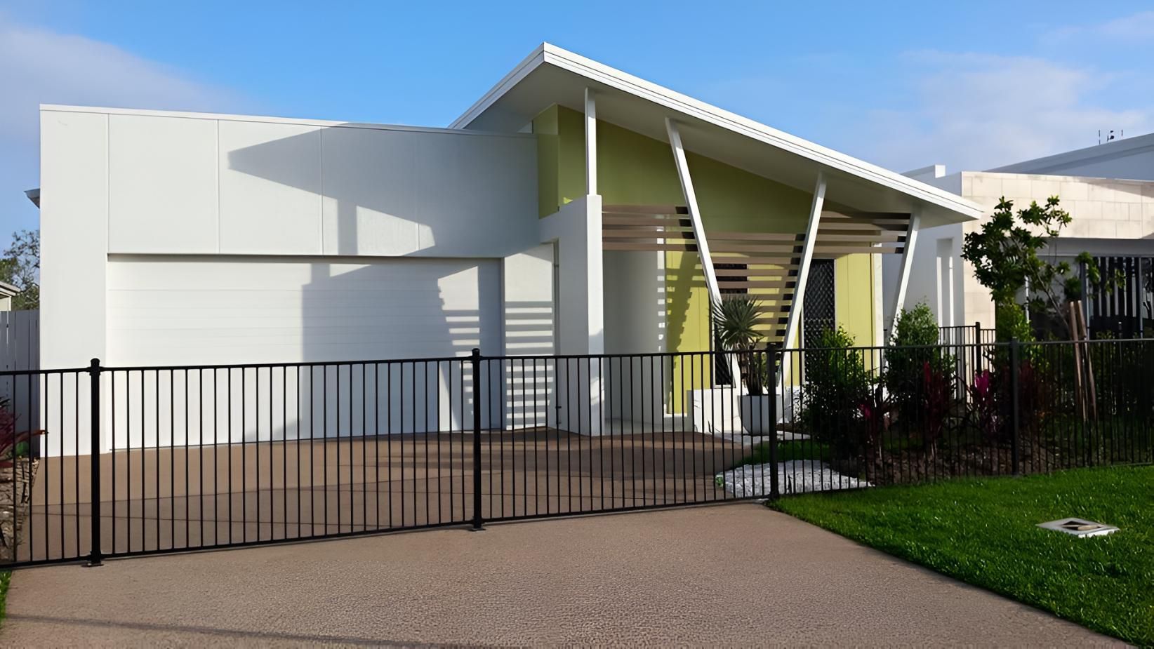 A White House With A Black Fence In Front Of It — Aaron Lee Painting Pty Ltd In North Shore, QLD