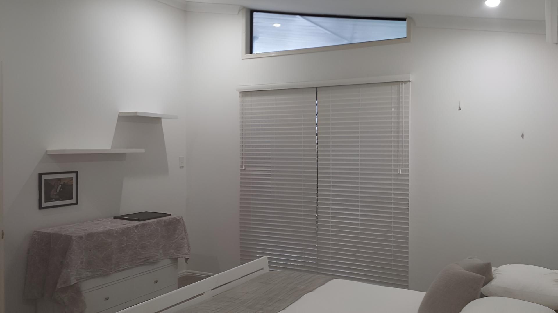 A Bedroom With A Bed, Dresser, Window And Blinds — Aaron Lee Painting Pty Ltd In Jensen, QLD