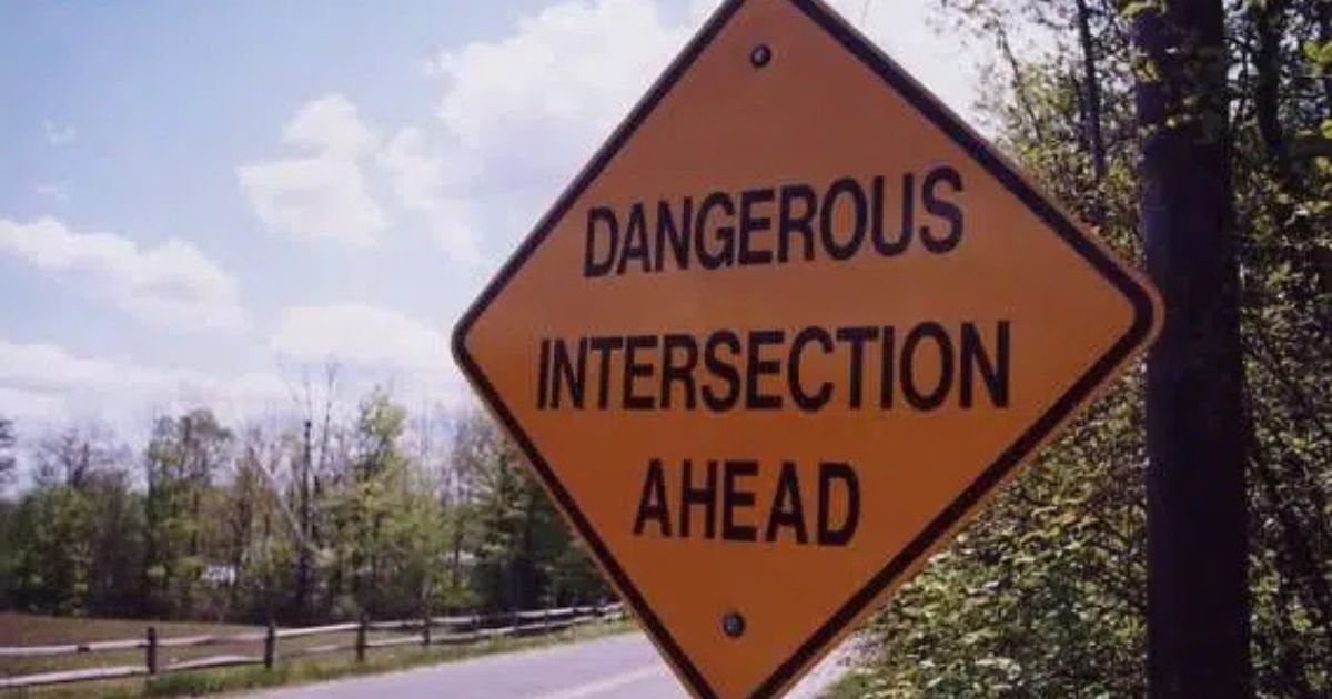 Yellow diamond road sign reads 