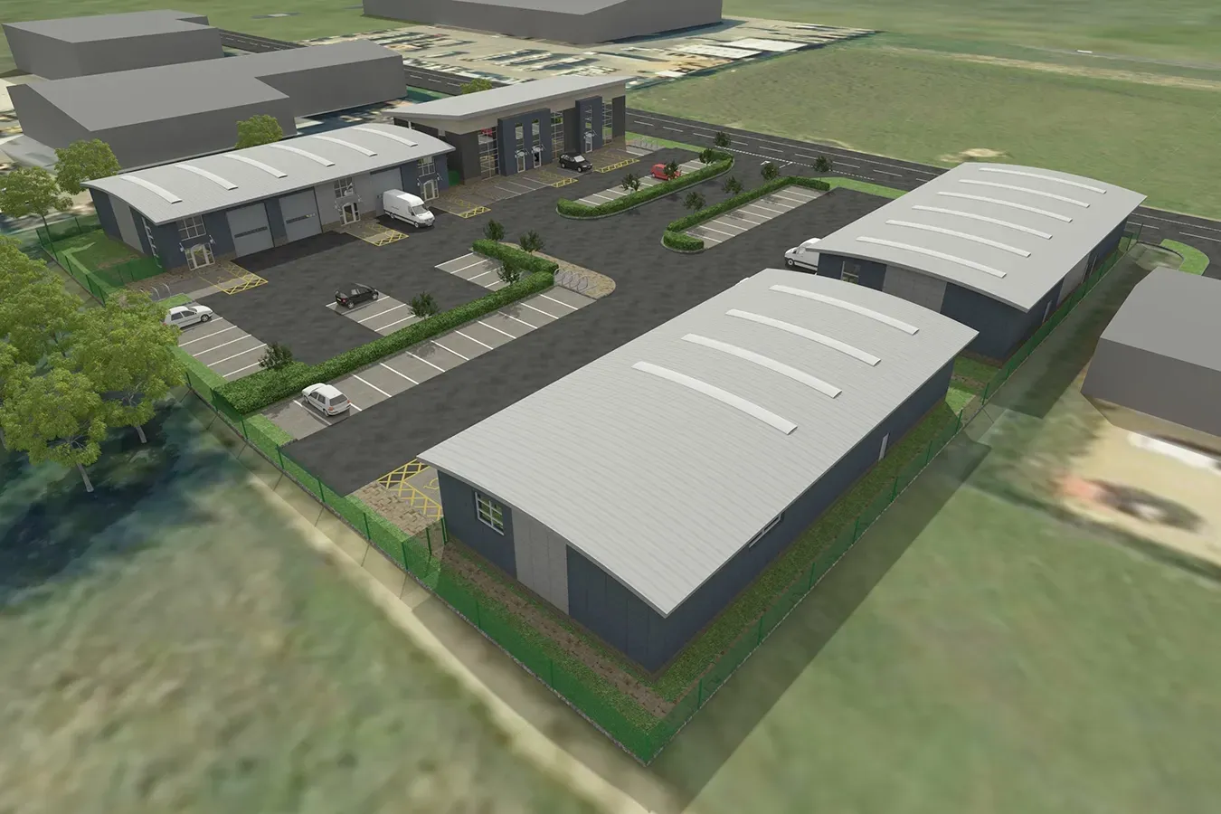 An aerial view of a large industrial area with lots of buildings and parking spaces.