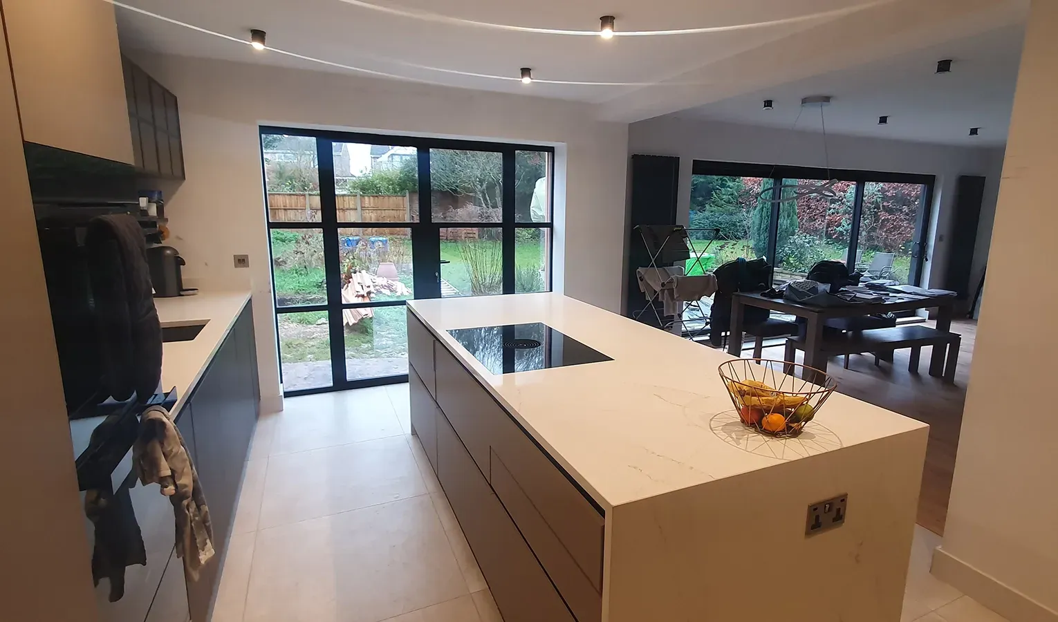 There is a large island in the middle of the kitchen.