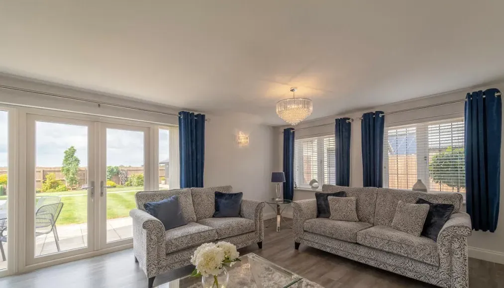 A living room with two couches and a coffee table.