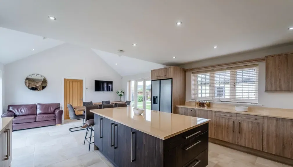 A kitchen with a large island in the middle of the room.