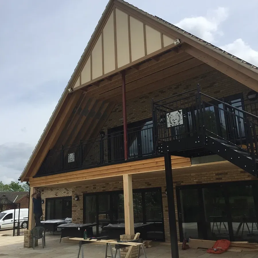 A large house with a balcony and stairs
