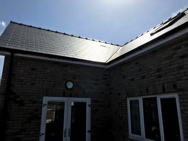 A house with a clock on the side of it