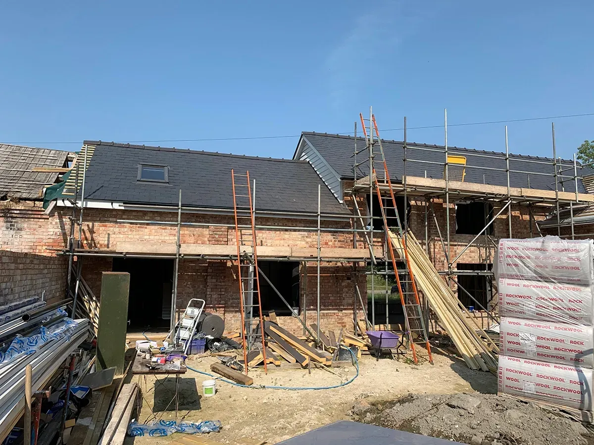 A house is being built with scaffolding around it.