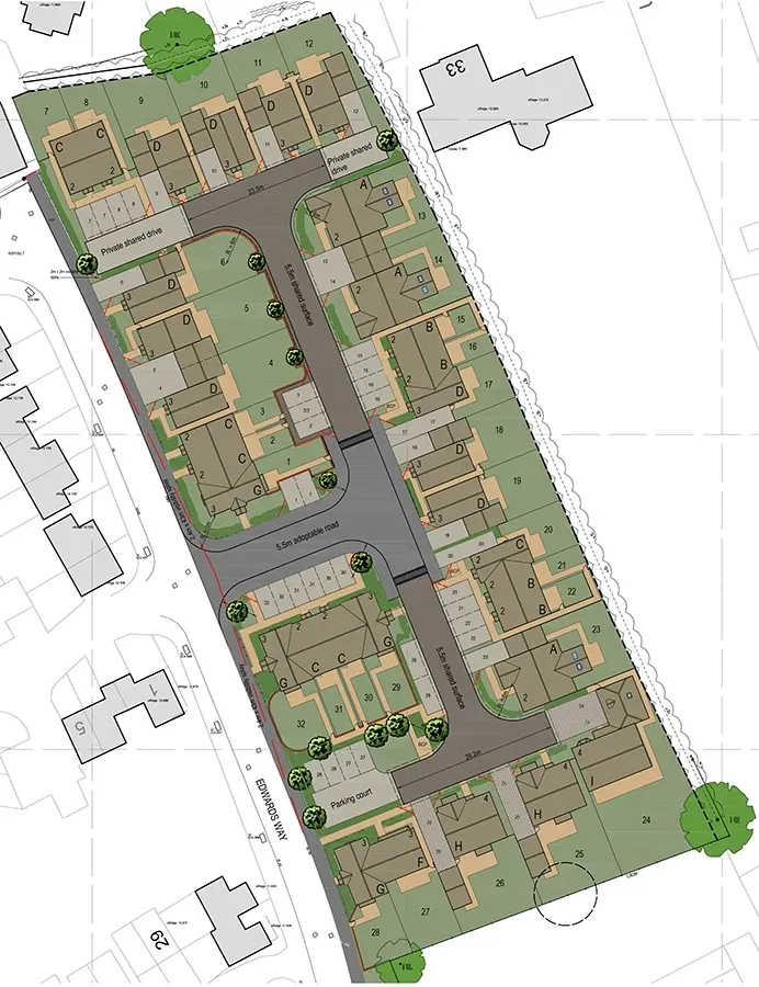 An aerial view of a residential area with lots of houses and trees.