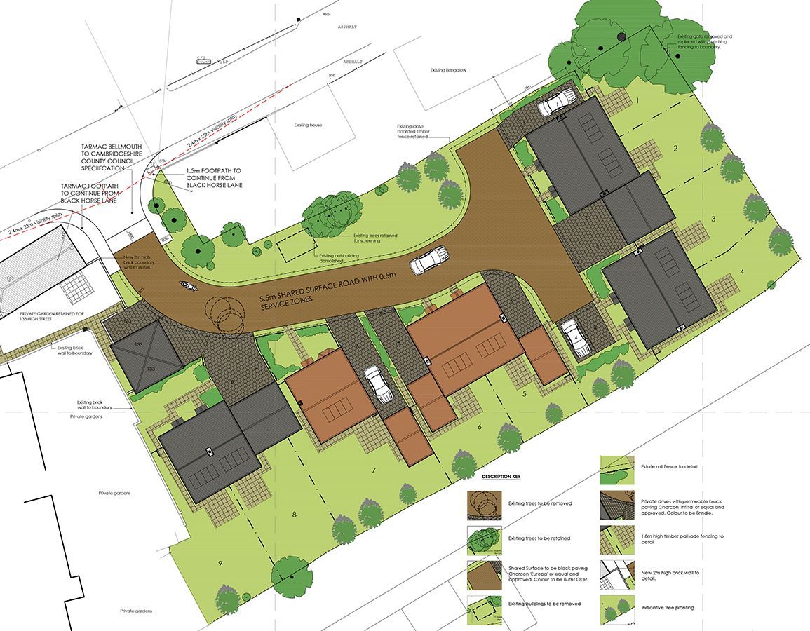 An aerial view of a residential area with houses and trees