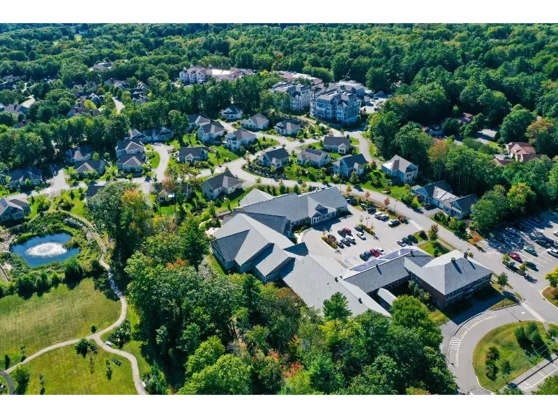 An aerial view of a residential area with houses and trees