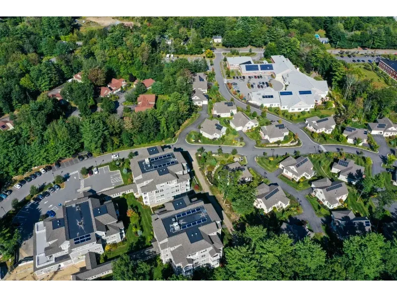 An aerial view of a residential area with lots of houses and trees
