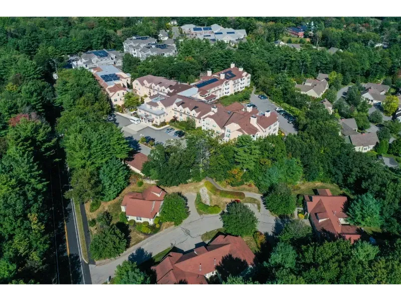 An aerial view of a residential area with houses and trees