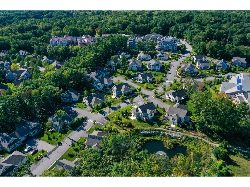 An aerial view of a residential area with lots of houses and trees