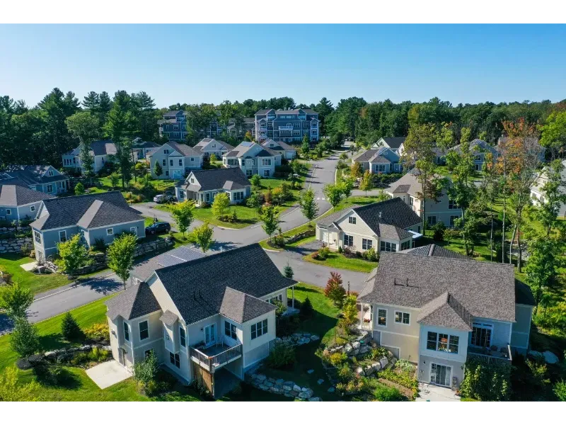 An aerial view of a residential neighborhood with houses and trees
