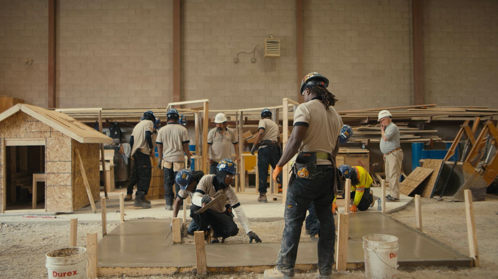 A group of construction workers are working on a construction site.