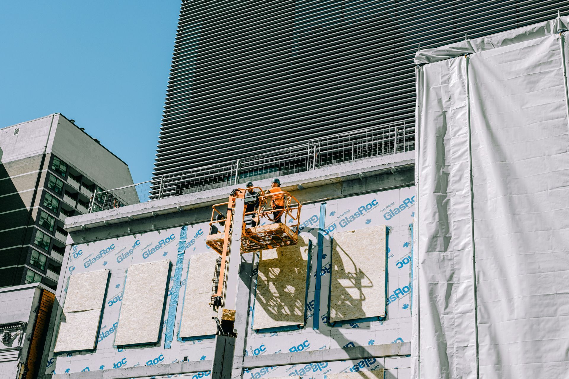 A group of people are working on a building.