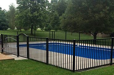 black fence around a residential pool