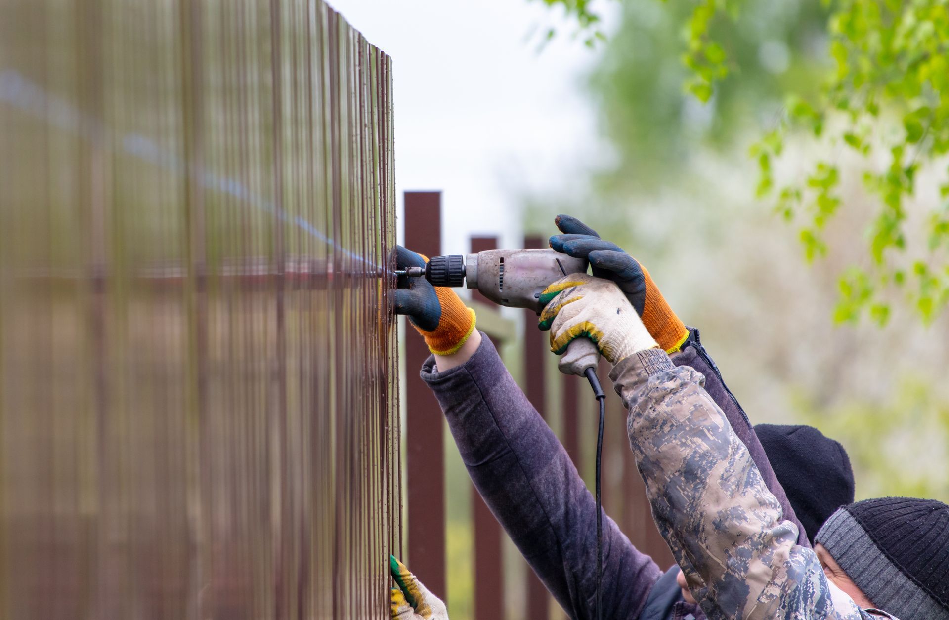 Installing Fence — Roanoke, TX — Lifetime Quality Construction