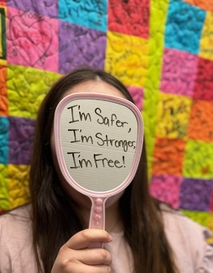 Person holding a mirror with