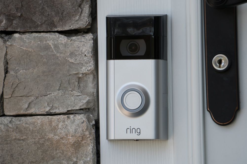 A close-up of a ring doorbell on a door