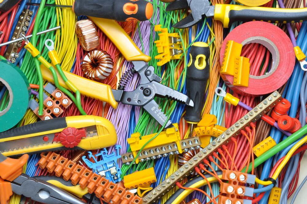 Bunch of Electrical Tools and Wires on a Table — Proserpine Electrical Services in Proserpine, QLD