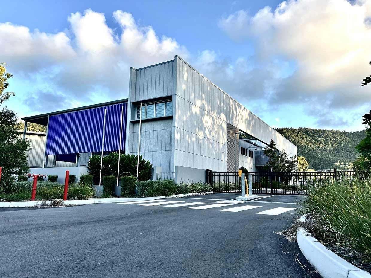 Tall Building With Blue Sky — Proserpine Electrical Services in Whitsundays, QLD