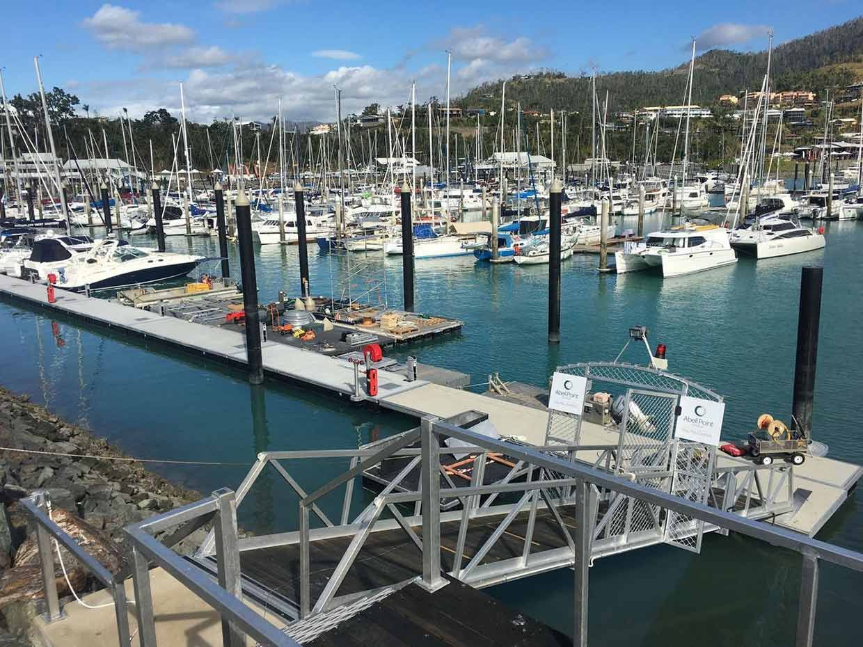 A marina filled with lots of boats and a dock