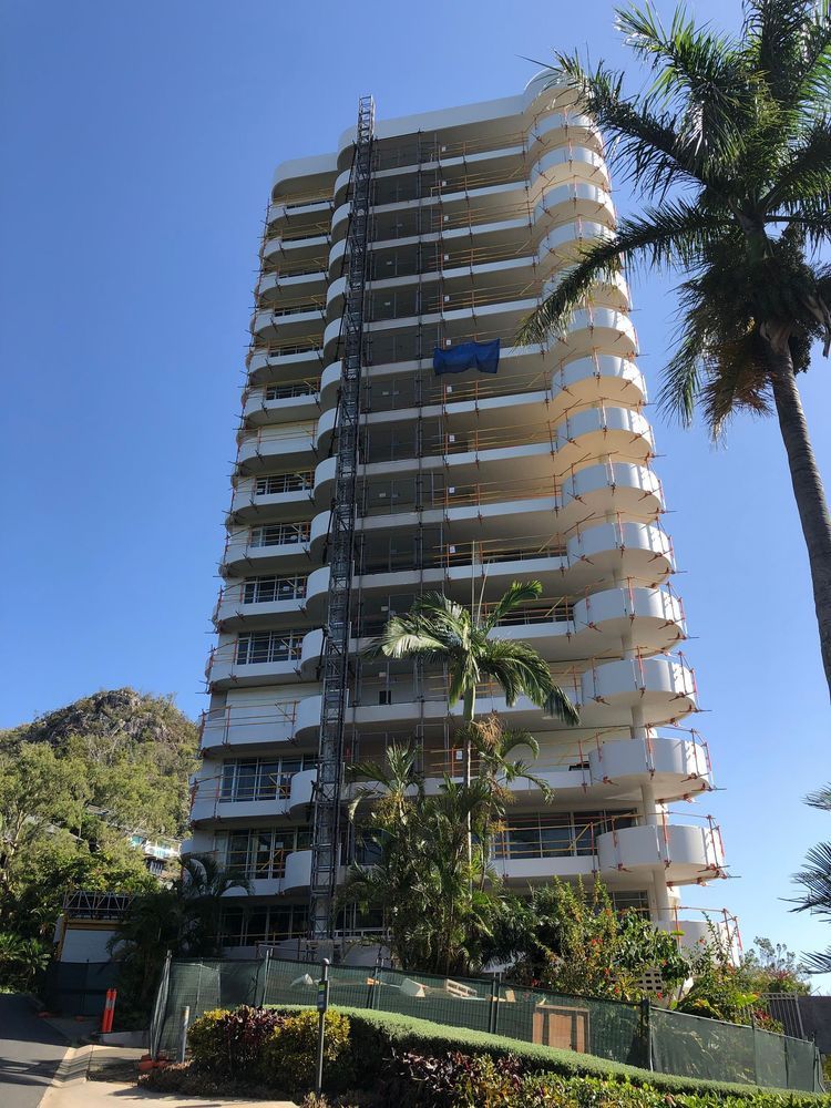 Tall Building Under Construction With Scaffolding — Proserpine Electrical Services in Proserpine, QLD