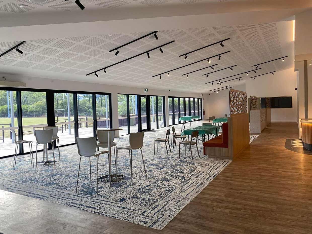 A Large Room with Tables and Chairs and A Lot of Windows — Proserpine Electrical Services in Whitsundays, QLD