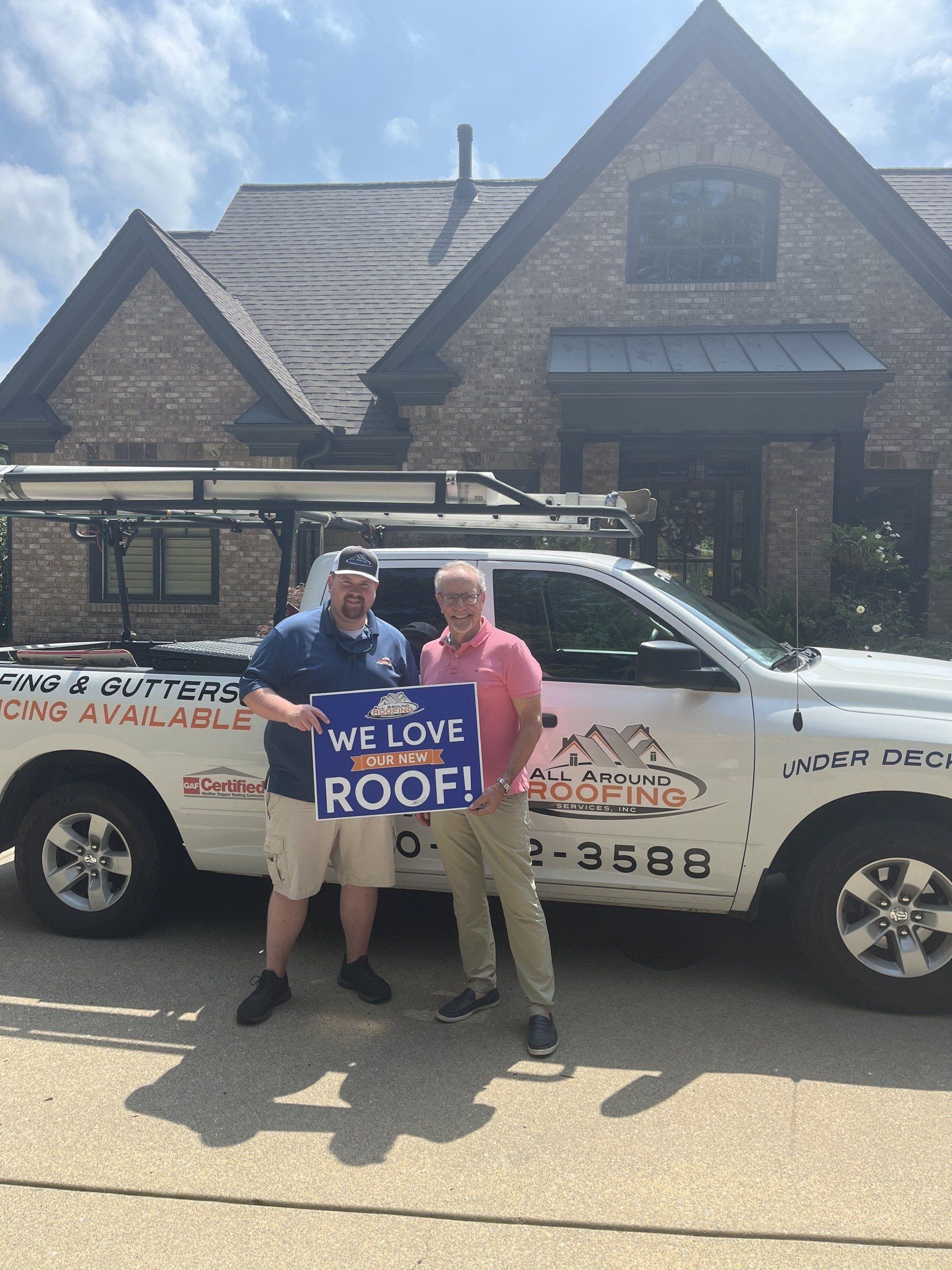 Two men holding a sign that says 