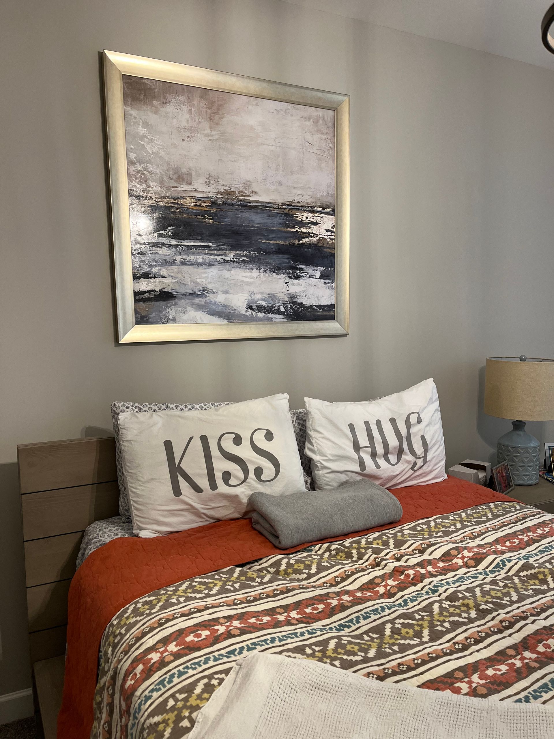 Bedroom with bed, decorative pillows 