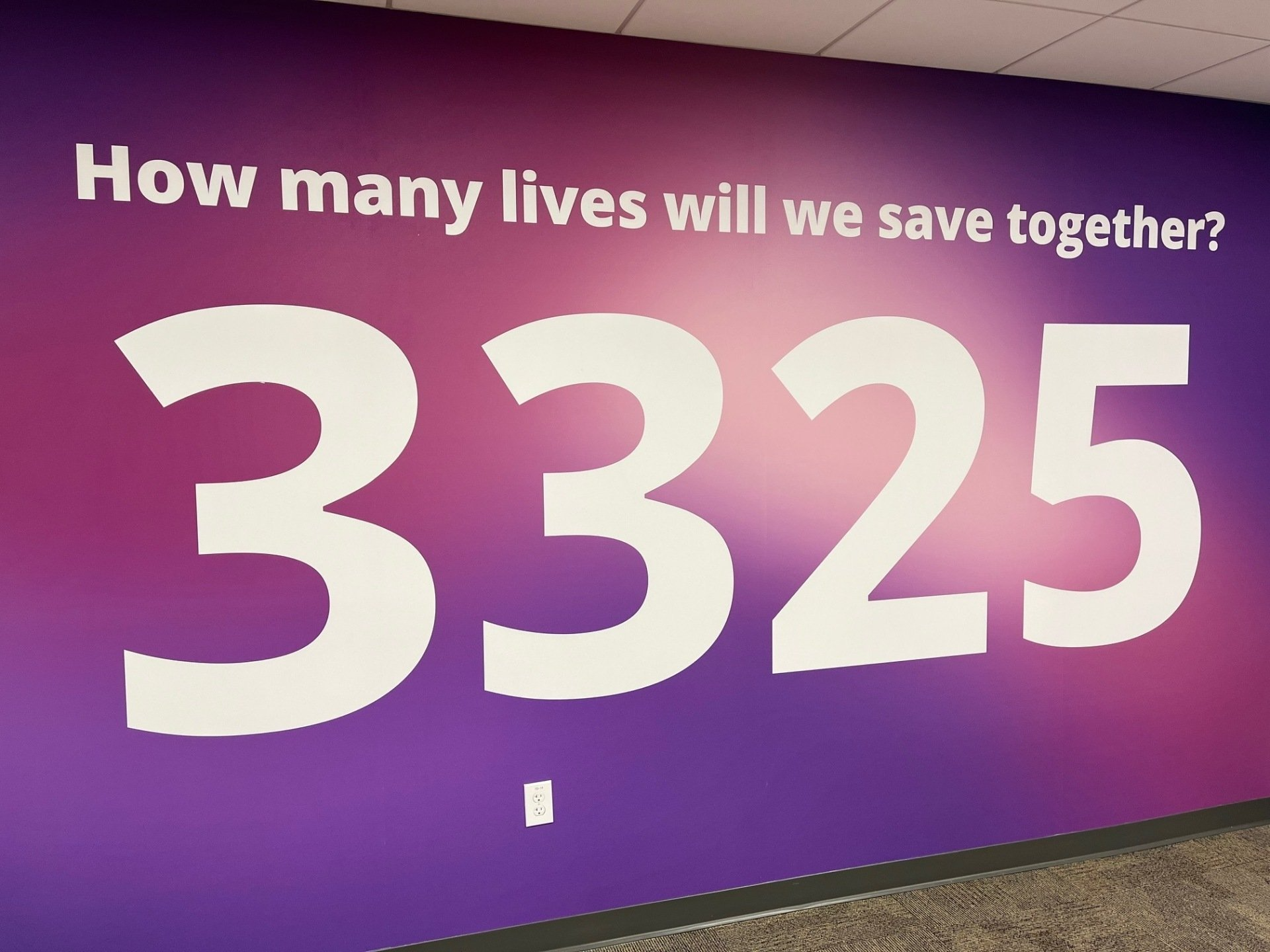 Purple wall with white text 