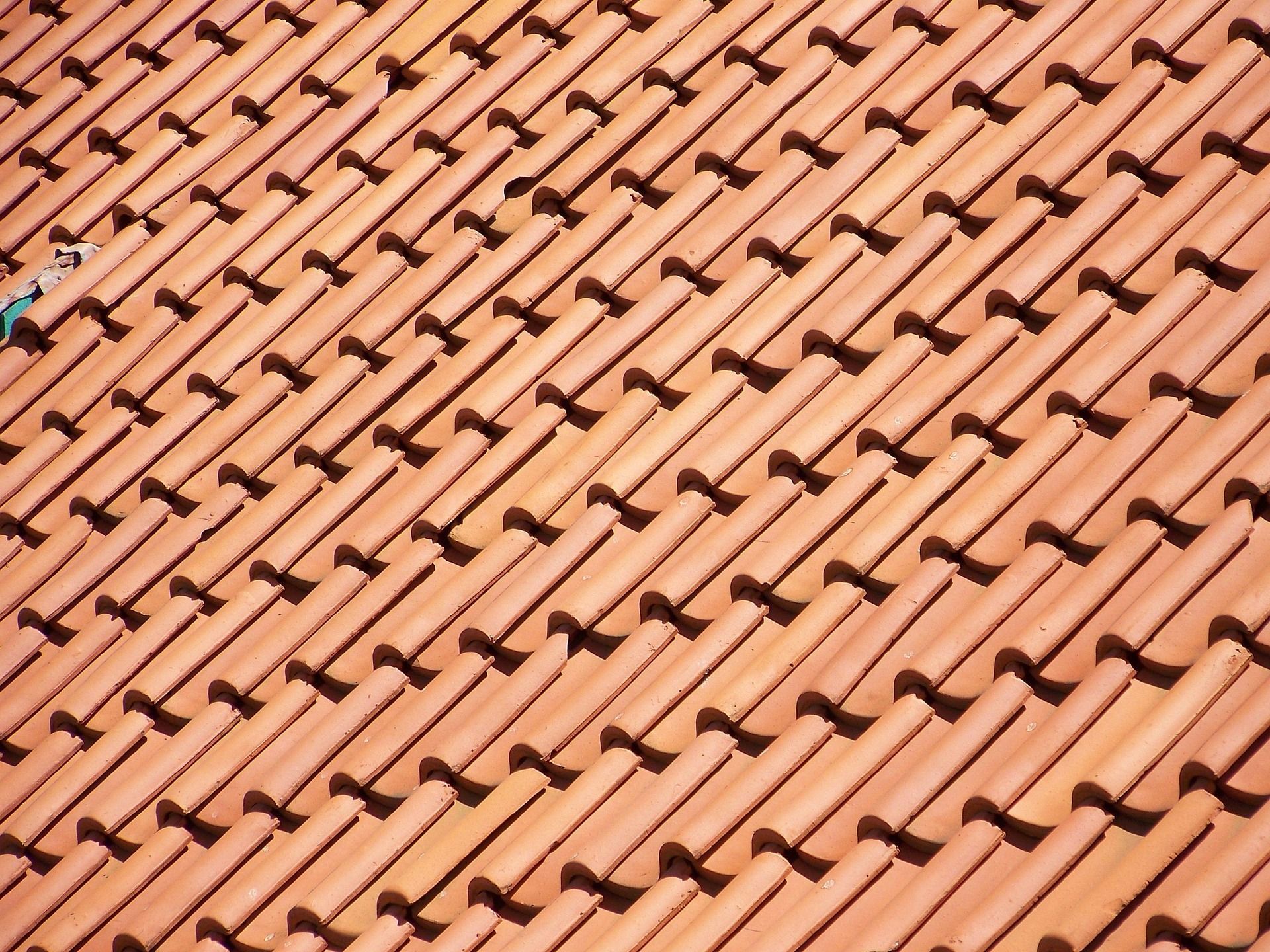 Terracotta roof tiles arranged diagonally.