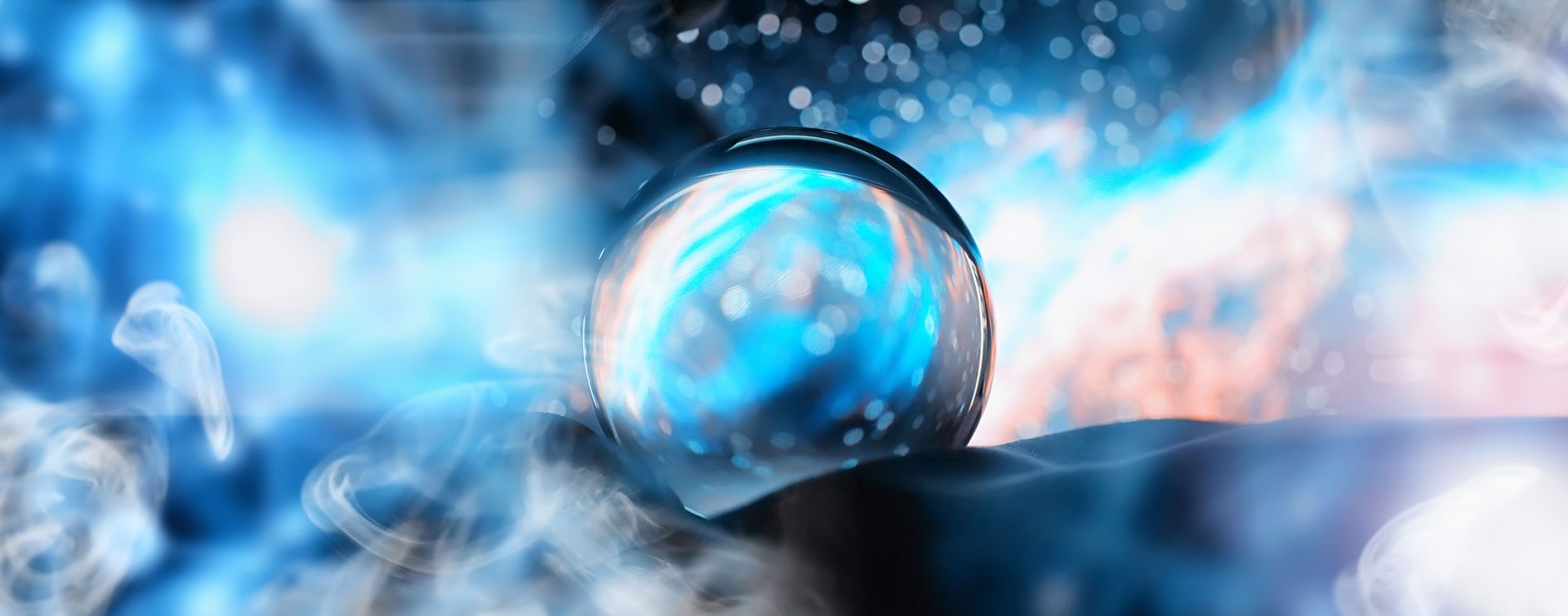 A glowing crystal ball amidst swirling blue energy and a dark surface.