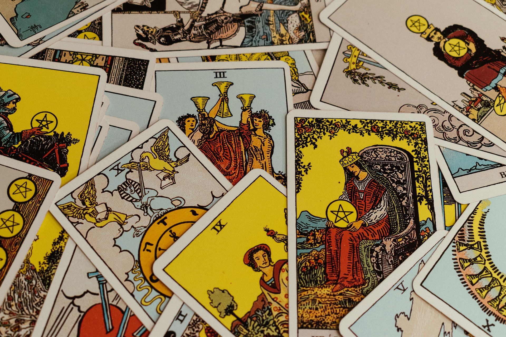 Tarot cards fanned out. Shows a variety of cards with colorful illustrations and symbols.