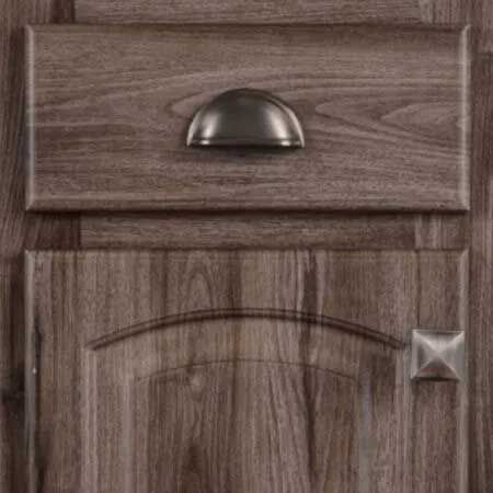 Wooden cabinet doors with a drawer above, featuring metal hardware.