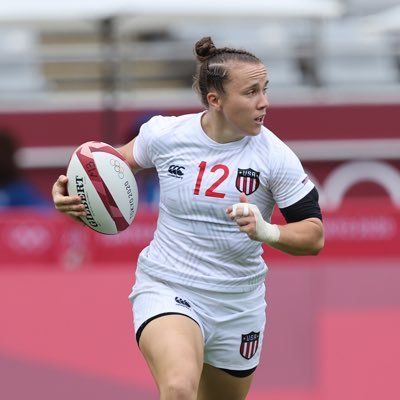 Strong woman playing rugby for USA