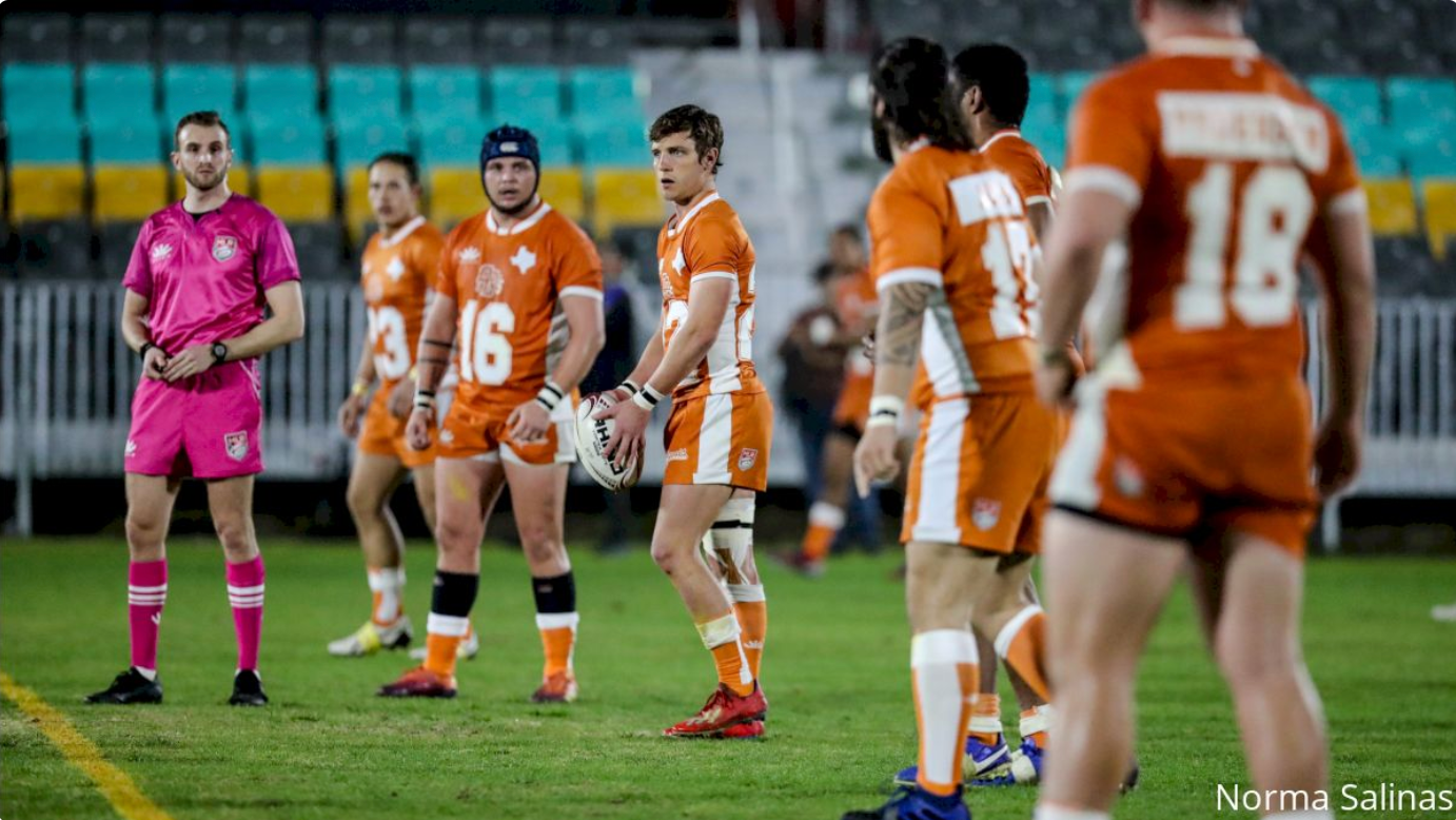 Male rugby player kicking the ball