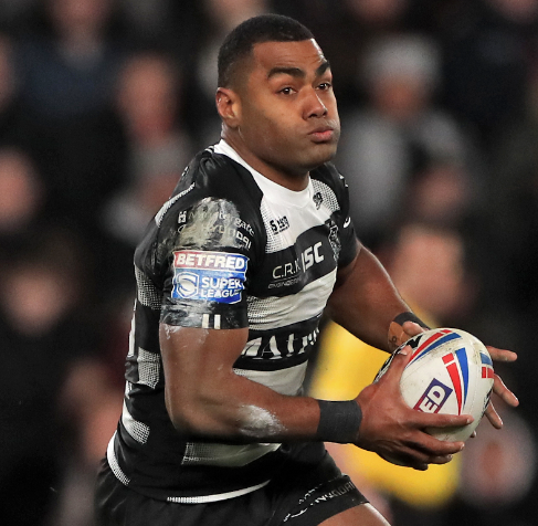 Fijian rugby player runs the ball