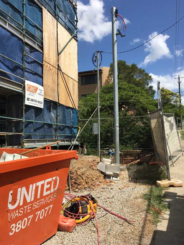 steel poles next to building