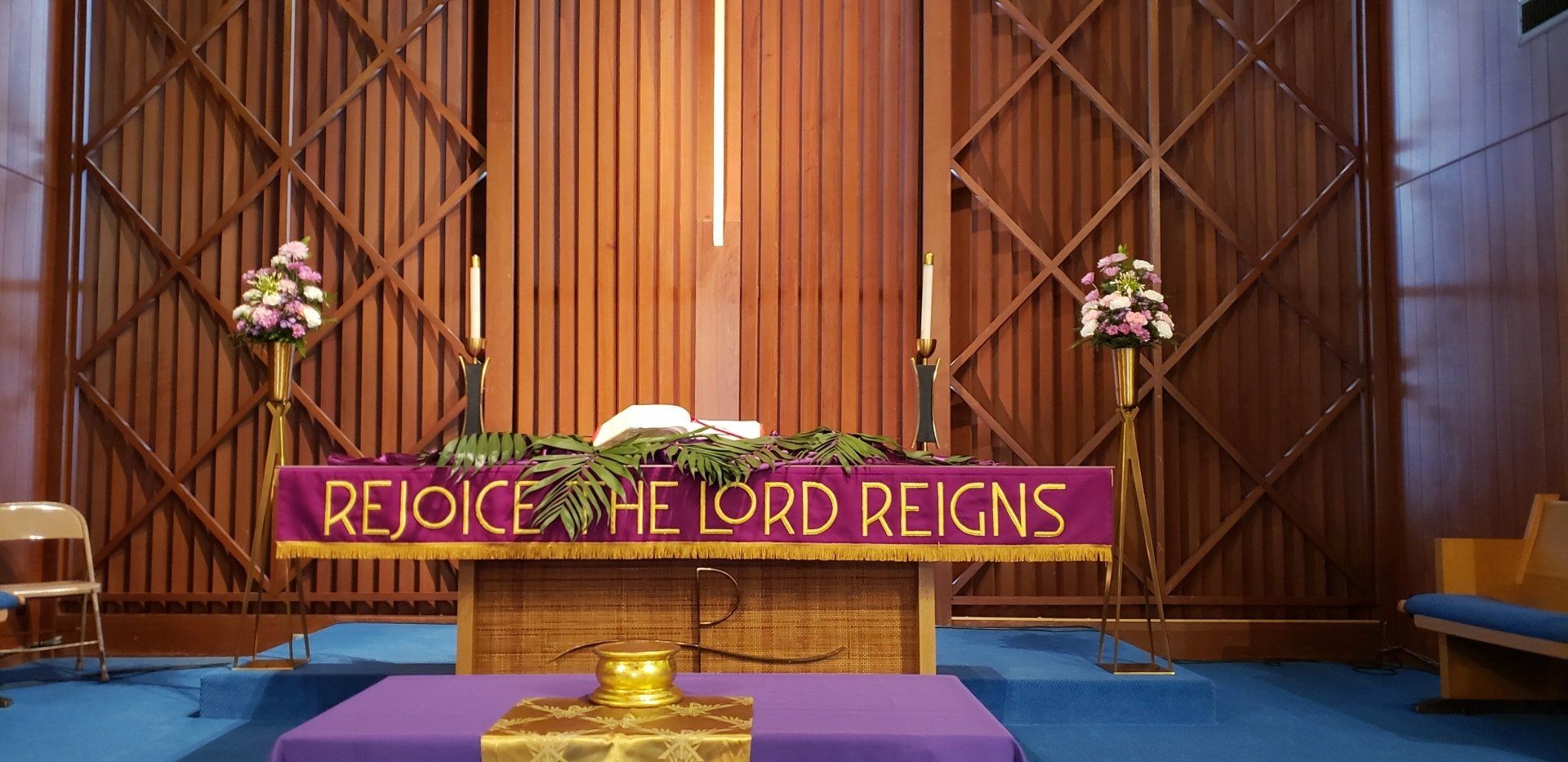 A church altar with a purple banner reading 
