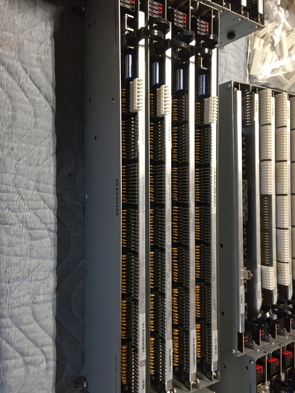 Rack of circuit boards, vertically aligned, with multiple rows of connectors.