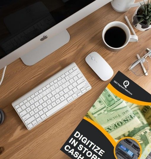 Laptop, keyboard, coffee, and brochure titled