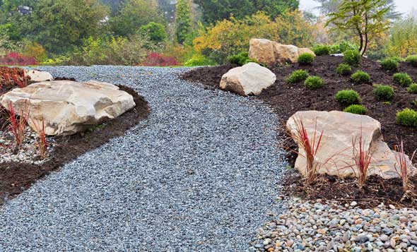 A beautiful summer herbaceous flower border in hazy sunshine
