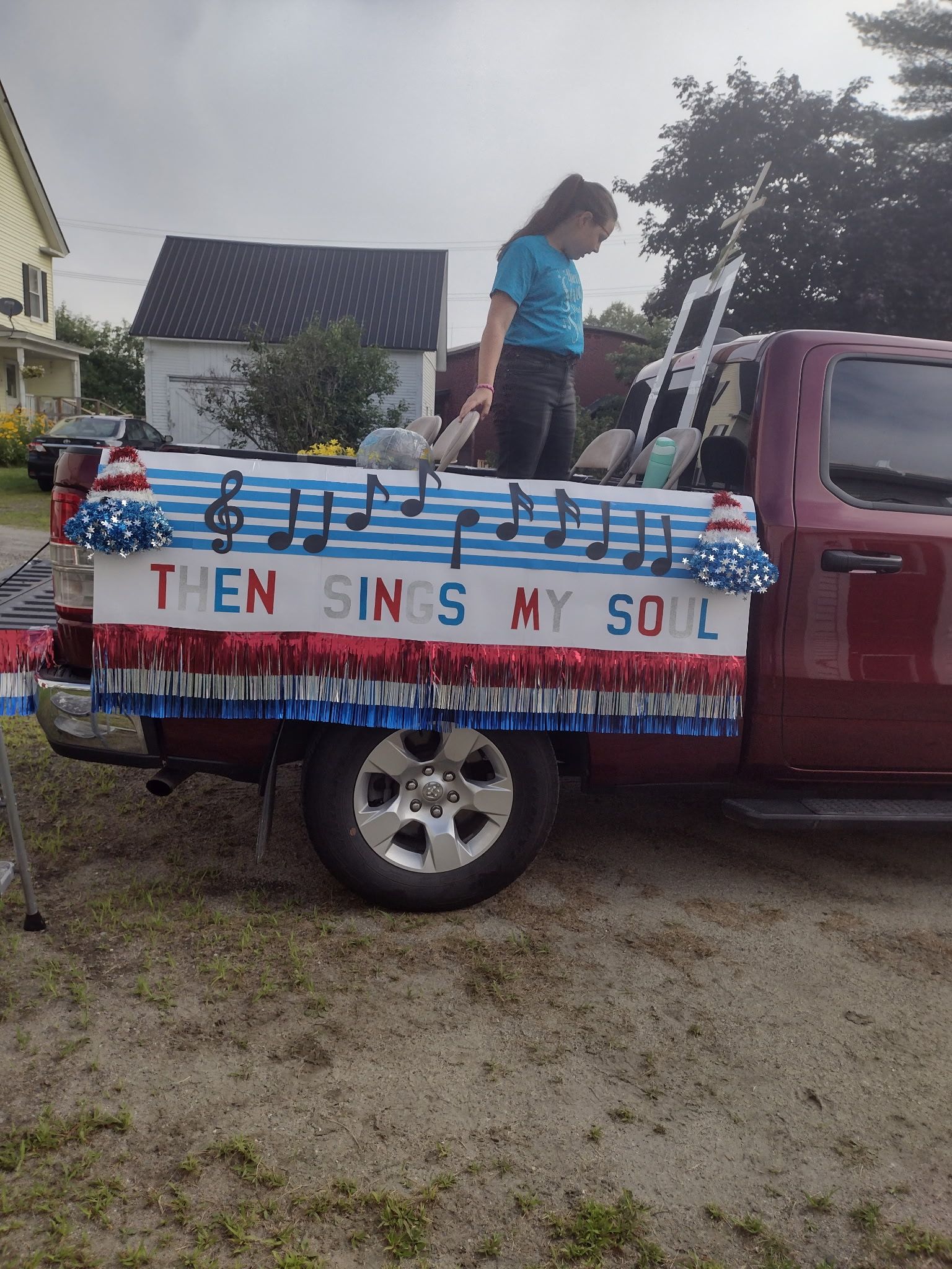 Red pickup truck decorated for a parade, 