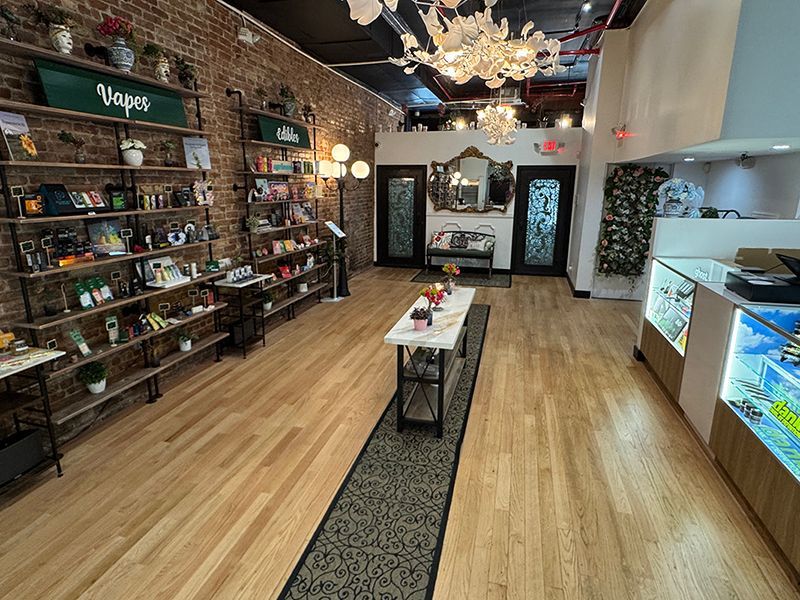 A store with wooden floors and a wrought iron door